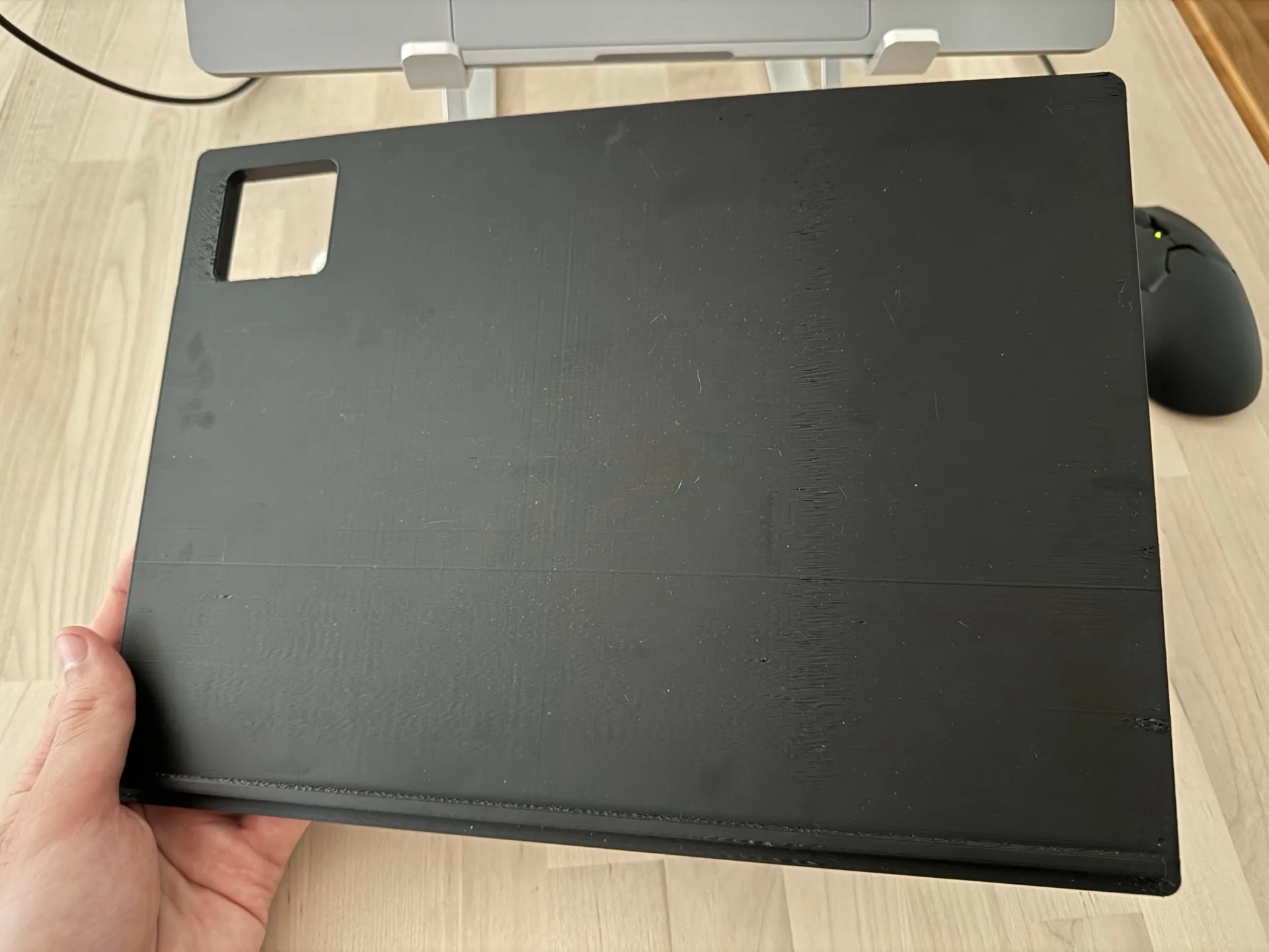 The tray, top side with a camera bump cutout